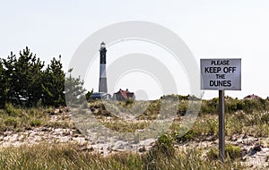 Keep of the dunes sign with The Fire Island Lighthouse in the background