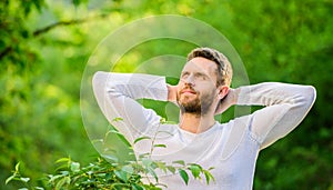 Keep it healthy way. Nature relax spa resort. Feel power of nature. Man handsome bearded guy morning stretching nature