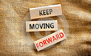 Keep moving forward symbol. Concept words Keep moving forward on blocks on beautiful canvas table canvas background. Business,