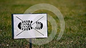 Keep off the grass sign