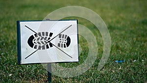 Keep off the grass sign