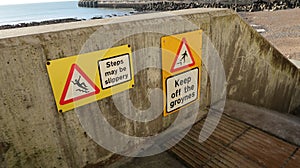 Keep off the groynes steps may be slippery sign.