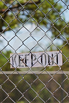 Keep out sign on fence