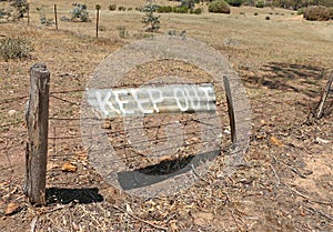 Keep Out sign painted on corrugated iron