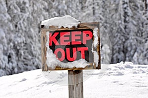 Keep Out Wooden Sign in Snow