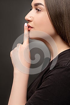 Keep quiet female mystery woman showing shhh
