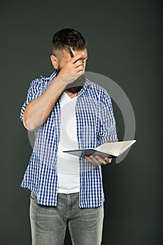 Keep reading, knowledge is power. Bearded man reading book on grey background. Univesity student reading for information