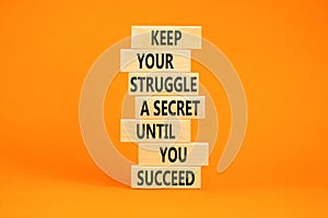 Keep secret symbol. Concept words Keep your struggle a secret until you succeed on wooden blocks. Beautiful orange table orange