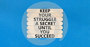 Keep secret symbol. Concept words Keep your struggle a secret until you succeed on wooden stick. Beautiful blue table blue