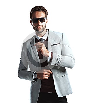 Keep it simple but make a statement. Studio shot of a handsome young man posing against a white background.