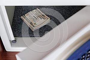 Keep us dollars in a safe place in the office or at home. Money under lock and key. Protection from thieves and burglars