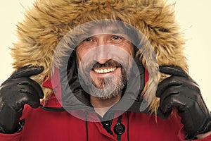 Keep your head snug in cosy hood. Happy man wear parka hood. Mature man smile in faux fur hood. Fashion trends for