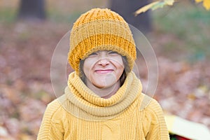 Keeping head warm in fall. Happy child wear knitted hat on autumn day. Small kid enjoy fall style. Little girl smile in