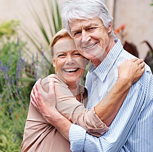 Keeping the love alive. Portrait of a happy elderly couple embracing each other.