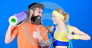 Keeping those muscles flexible. Healthy lifestyle concept. Man and woman with yoga mat and sport equipment. Fitness