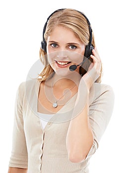 Keeping our customers happy. Studio portrait of an attractive young woman talking on a headset isolated on white.