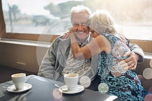 Keeping the romance alive with a good old coffee date. a mature couple spending the day together.