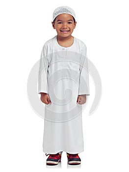 Keeping tradition alive. Studio portrait of a cute little muslim boy isolated on white.