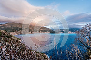 Kefalonia coastline, with rocky coast and dramatic sky on sunset. Greece vacation trip