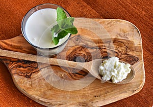 Close-up shot on a full glass of white Kefir photo