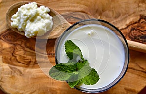 Close-up shot on a full glass of white Kefir photo