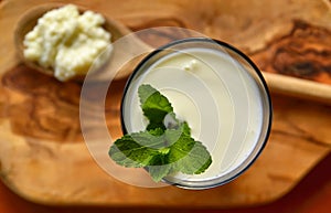 Close-up shot on a full glass of white Kefir photo