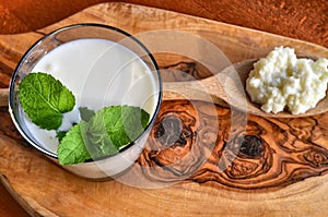 Close-up shot on a full glass of white Kefir photo