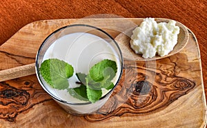 Kefir enriched with some mint leaves photo