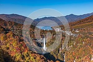 Kegon Waterfall in autumn colors of many trees and lake seen from Akechidaira Observatory, Lake Chuzenji, Nikko, Japan. Favorite t