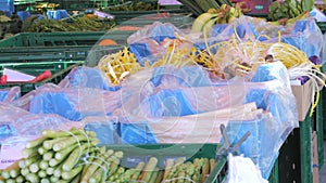 Kehl, Germany - April 12, 2024: Green and white fresh spring asparagus on a farmer's market counter in spring