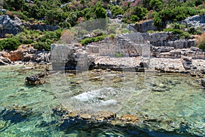 Kekova where sunken shipwrecks of Dolkisthe Antique City which was destroyed by earthquakes in the 2nd century, Tukey photo