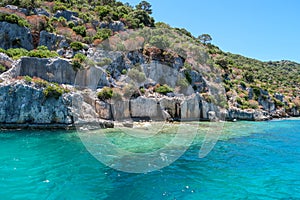 Kekova where sunken shipwrecks of Dolkisthe Antique City which was destroyed by earthquakes in the 2nd century, Tukey photo