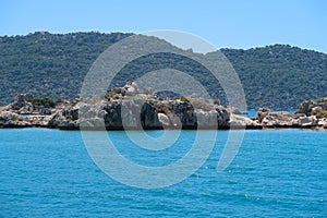 Kekova where sunken shipwrecks of Dolkisthe Antique City which was destroyed by earthquakes in the 2nd century, Tukey