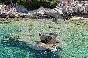 Kekova where sunken shipwrecks of Dolkisthe Antique City which was destroyed by earthquakes in the 2nd century, Tukey