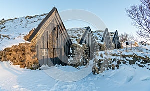 Keldur turf house farm in an Icelandic winter landscape, in the south of Icelan. Soft afternoon light. Traditional Icelandic farm