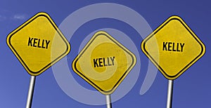 Kelly - three yellow signs with blue sky background