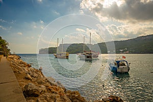 KEMER, TURKEY: Sea and rocks, parking of yachts and ships near Yoruk park.