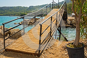 KEMER, TURKEY: View of a small bridge near the canal on the beach in Kemer.