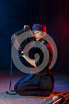Kendo female wearing protective helmet on head
