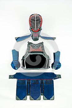Kendo - Kendoka armor and equipment arranged and displayed on white background.