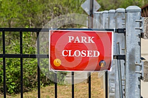 Park closed sign at Cobb County park during mandatory stay at home shelter in place order passed for Covid-19 Corona Virus