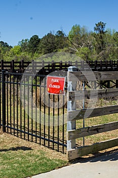 Park closed sign at Cobb County park during mandatory stay at home shelter in place order passed for Covid-19 Corona Virus