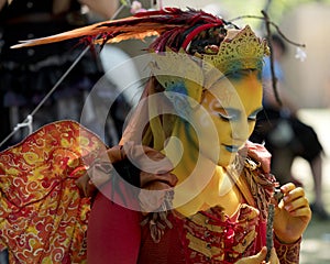 A colorful beautiful girl dressed as a fairy at the annual Bristol Renaissance Faire