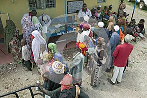 Kenyan women stand in line to get health checkup for HIV/AIDS at the Pepo La Tumaini Jangwani, HIV/AIDS Community Rehabilitation