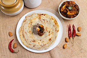 Kerala porotta and beef curry, layered flatbread