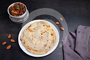 Kerala porotta and meat curry, layered flatbread