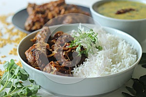 Kerala style dry chicken roast and lentil curry prepared with fenugreek leaves served with basmati rice. A healthy combination