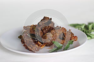 Kerala style mutton roast prepared with coconut oil