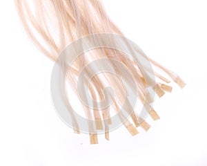 Keratin capsules of blonde hair extensions photo