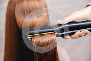 Keratin recovery hair and protein treatment pile with professional ultrasonic iron tool. Concept straighten photo